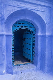 Africa, Morocco. A traditional blue doorway in the hilltown of Chefchaouen