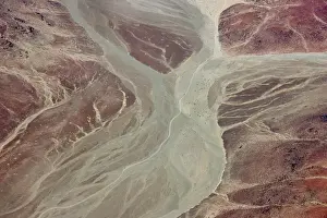 Namibia Prints: Africa, Namibia, Damaraland. Aerial view of dry river beds running through red rock