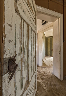 Africa, Namibia, Kolmanskop, Sperrgebeit. View in abandoned sand-filled house. Credit as