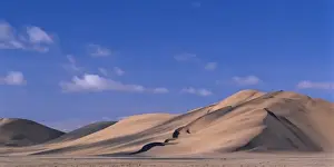 Walvis Bay Prints: Africa, Namibia, Namib Desert, Setting sun lights wind-blown sand along dunes near