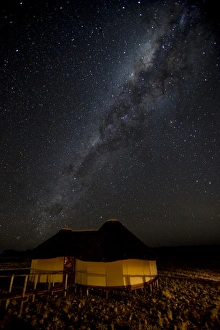 Images Dated 27th August 2014: Africa, Namibia, Namib-Naukluft Park, Dune Lodge. Lodging hut and Milky Way. Credit as