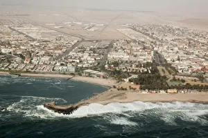 Walvis Bay Prints: Africa, Namibia, Swakopmund. Aerial view of the city and bay