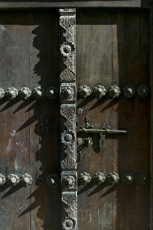 Images Dated 25th November 2005: Africa, Tanzania, Zanzibar, Stone Town, Morning sun lights elaborately carved wooden