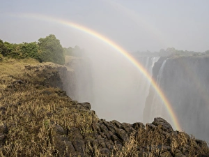 Africa, Zimbabwe, Victoria Falls. Rainbow over waterfall