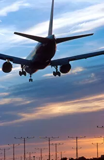 Airplane landing at LAX airport in Los Angelas, California at sunset