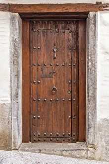 Granada Prints: Albaicin, Province of Granada, Andalusia, Spain. An old wooden door on a building