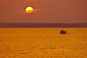 Passenger Ferry Prints: Amazon River, Brazil. Local passenger ferry at sunset
