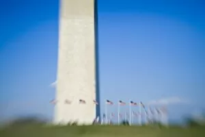 Images Dated 13th April 2006: American flags surround Washington Monument (blurred), Washington D. C. (District of Columbia)
