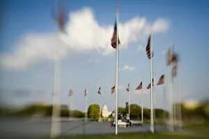 Images Dated 13th April 2006: American flags next to Washington Monument (blurred), Washington D.C. (District of Columbia)