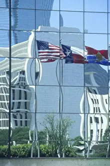 Dallas Prints: American and Texas state flags reflecting in hotel windows, Dallas, Texas