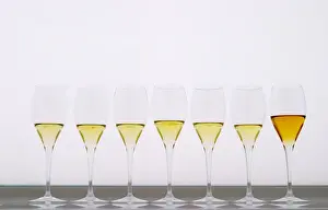 Expensive Prints: Analytical wine tasting in a neutral white environment a white desk a backlit white