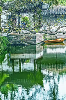 Ancient Chinese pagoda reflection. Humble Administrator's Garden, Jiangsu, China. Garden built in the 1500's, UNESCO site