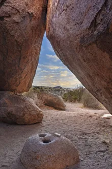 Mortar Prints: Ancient Native American mortar grinding stone in rock shelter at Council Rocks in