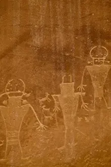 Carving Prints: Ancient petroglyphs from the Fremont people on canyon wall at Capitol Reef National