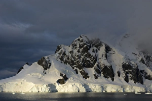 Images Dated 19th February 2014: Antarctica. Antarctic Peninsula. Gerlache Strait. Orne Harbor. Mount Fourcade. Sunset