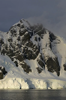Images Dated 19th February 2014: Antarctica. Antarctic Peninsula. Gerlache Strait. Orne Harbor. Mount Fourcade. Sunset