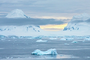Images Dated 17th April 2024: Antarctica. Icebergs and mountains at sunset