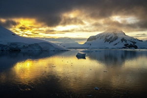 Images Dated 17th April 2024: Antarctica, Paradise Bay. Mountain reflections at sunset