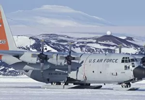 Antarctica, Ross Island, McMurdo station, C-130 Hercules on ice runway, Mt. Erebus beyond