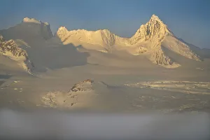 Images Dated 3rd January 2020: Antarctica, South Georgia Island. Sunset on snow-covered mountains glaciers