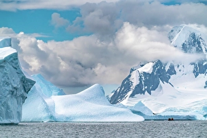 Images Dated 17th April 2024: Antarctica, Yalour Islands. Tourists in Zodiacs viewing icebergs