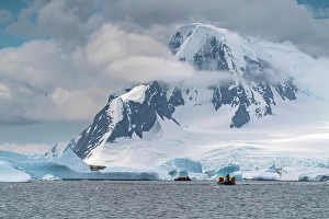 Images Dated 17th April 2024: Antarctica, Yalour Islands. Tourists in Zodiacs viewing icebergs