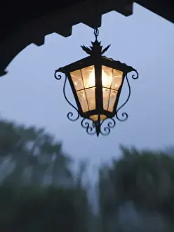 Antigua Prints: Antigua, Guatemala. Lamps in the colonial arched doorways near the town square
