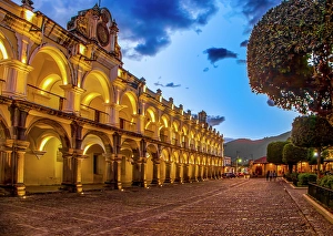 Antigua Prints: Antigua, Guatemala. Wide angle landscape view of the Captain General Palace on the Central Plaza at sunset