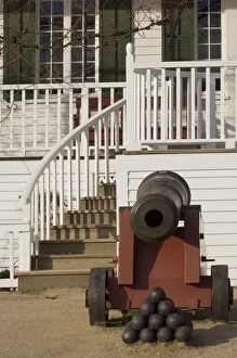 An antique cannon sits outside of the entrance to the officers quarters at Fort Vancouver