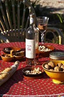 Aperitif and appetizers prepared: bread, olives, walnuts, Domaine du Loou Coteau
