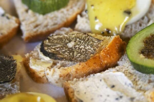 Appetizers made with truffles: small pieces of bread with truffles butter, slices