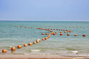 Aqua Prints: Arabian Peninsula, Persian Gulf, State of Qatar, Doha. Orange buoys in bay