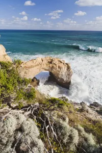 Natural Arch Prints: The Arch, Great Ocean Road, Australia, in stormy weather, breakers are coming in