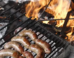 Images Dated 25th October 2007: Argentina, El Calafate. Parrillada (mixed grilled meat) cooking on a grill