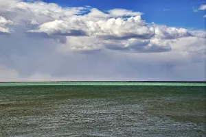 Santa Cruz Prints: Argentina, Santa Cruz. Puerto Santa Cruz, river Santa Cruz under stormy clouds
