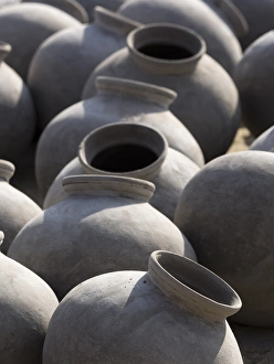 Pottery Prints: Artisan making clay pot in Chhatrasagar, Rajasthan, India