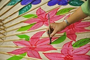 Artist hand painting decorative umbrella, Umbrella Making Center, Bo Sang, near Chiang Mai