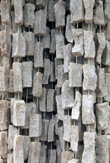 Roadside Prints: Asia, Bhutan, Wengdue. Yak Cheese, smoked and dried, hangs at roadside spots in Bhutan