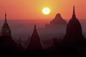 Buddhism Prints: Asia, Burma, (Myanmar), Pagan (Bagan) The temple complex of Pagan at dawn. Gilded