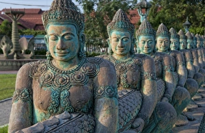 Prints of Row of Buddha statues in downtown Siem Reap, Cambodia, at sunset Images Dated 2027 November: Asia, Cambodia