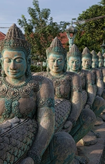 Prints of Row of Buddha statues in downtown Siem Reap, Cambodia, at sunset Images Dated 2027 November: Asia, Cambodia