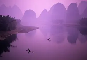 Yangshuo Prints: Asia, China, Guanxi, Yangshou. Fishermen on raft in Li River