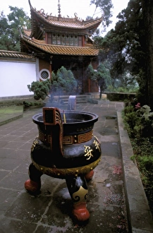 Asia, China, Yunnan Province, Kunming, Bamboo Village. Temple and incense burning