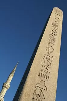 Asia, Europe, Turkey, Istanbul. An Egyptian obelisk with the minaret of Blue Mosque