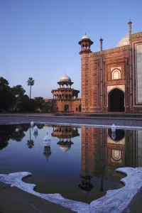 Uttar Pradesh Prints: Asia, India, Agra. A mosque is reflected in a still pool in the Taj Mahal Complex