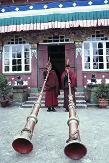 Monk Prints: Asia, India, Darjeeling. Buddhist monks at Ghoom Monastery are dwarfed by their enormous