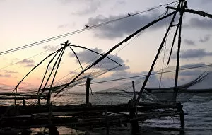 Asia, India, Kerala, Kochi (Cochin). A silhouette of a Chinese fishing net