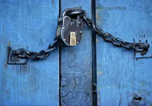 Chain Prints: Asia, India, Ladakh, Kargil. A padlock secures a blue door in Kargil, Ladakh, India