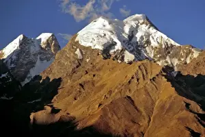 Jagged Prints: Asia, India, Ladakh, Padum. Late light illuminates the snowy tops of the Himalayas