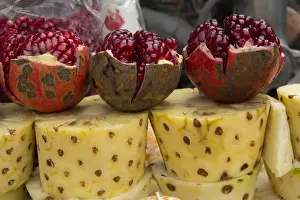 Pineapple Prints: Asia, India, New Delhi, street vendors cart with display of opened pomegranates